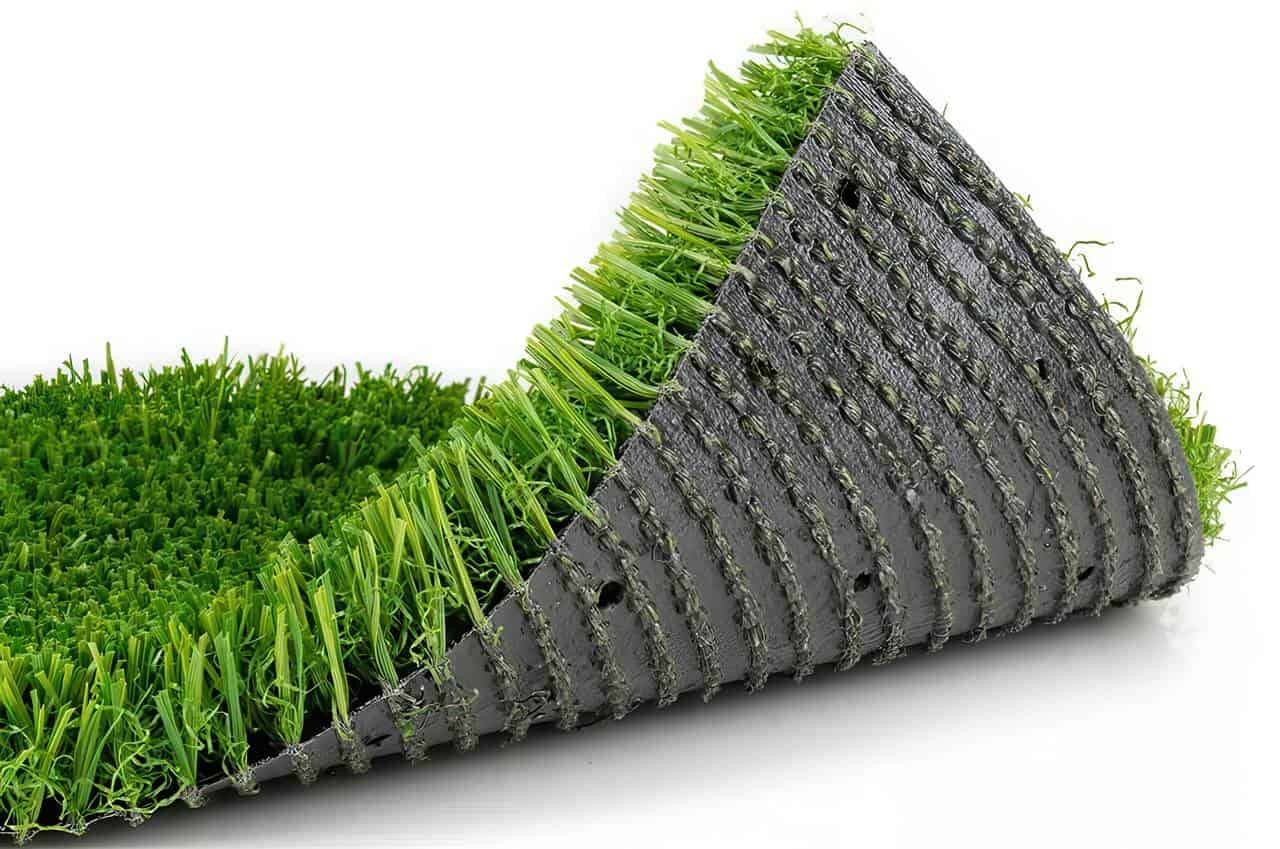 A close-up of artificial grass shows the backing with evenly spaced drainage holes, designed to allow water to pass through efficiently.
