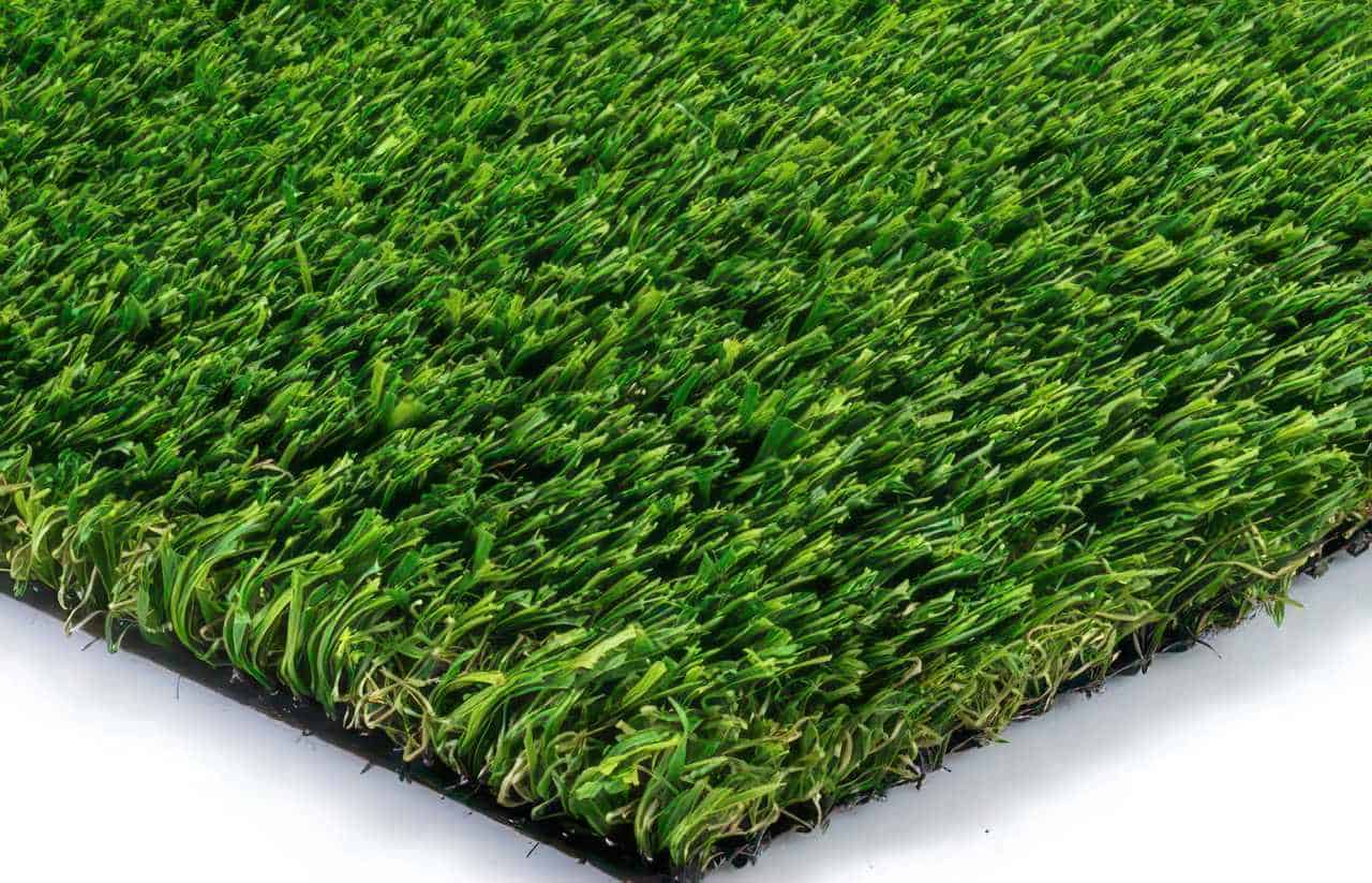 Close-up of artificial turf sample with mixed green blade tones and realistic texture, highlighting natural-looking color blend.