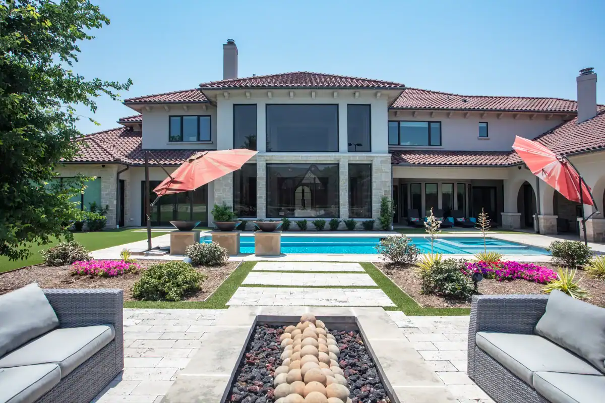 Artificial Pet Turf in Highland Park Artificial Pet Turf in Highland Park with paver grids and a large pool