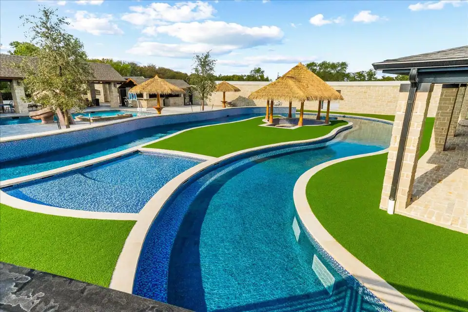 Artificial Grass Lawn in Highland Park Artificial Grass Lawn in Highland Park with a pool and a lazy river