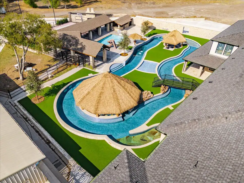 Artificial Pet Turf in Flower Mound around lazy river with a swim up bar