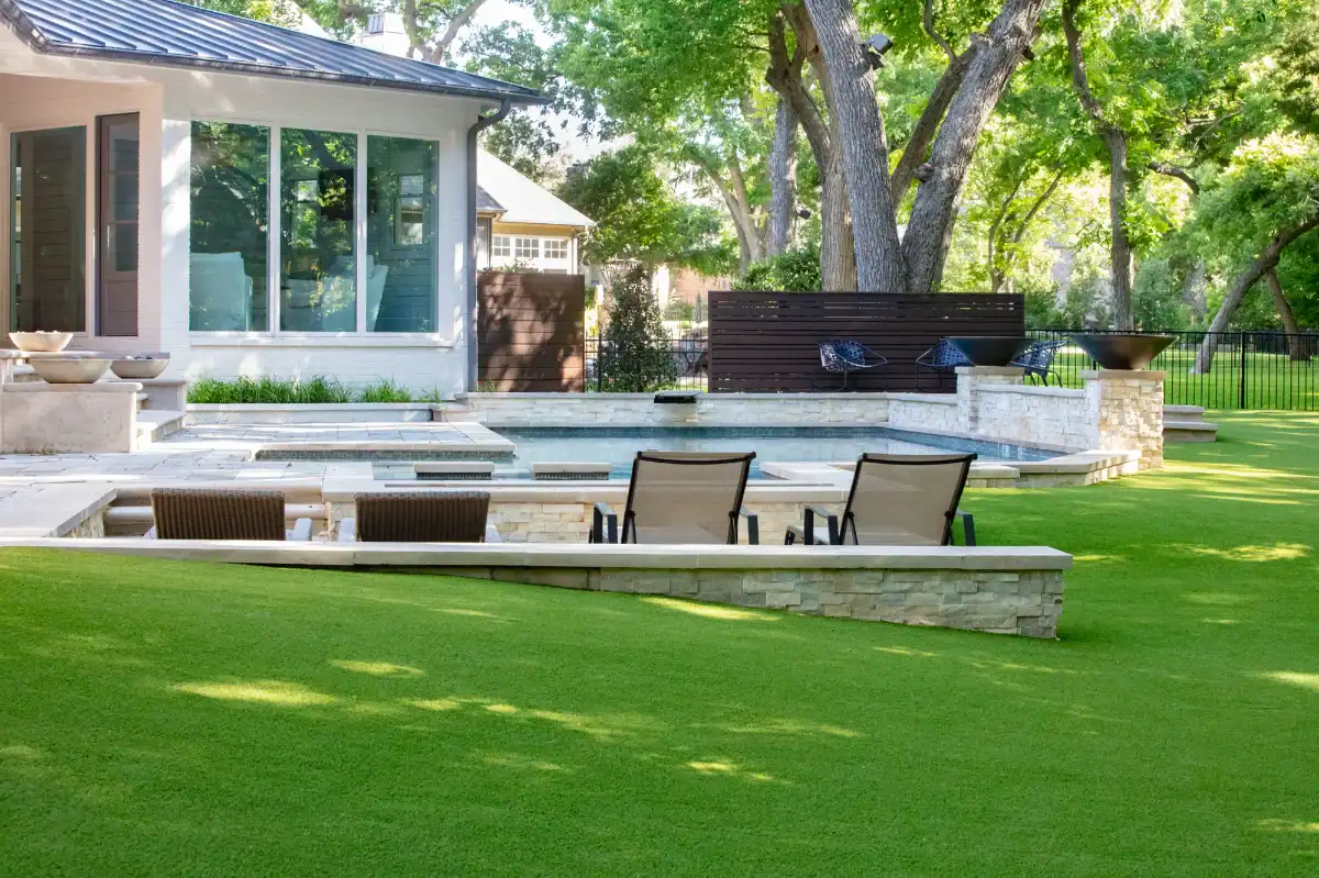 Artificial Grass Lawn in Southlake Artificial Grass Lawn in Southlake with a pool in a neighborhood