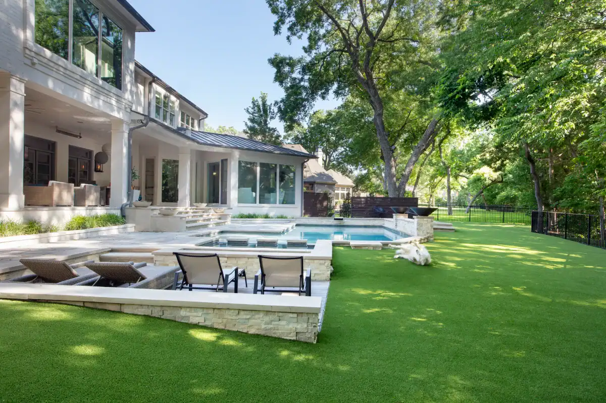 Pet Turf Yard in Richardson Artificial Pet Turf Yard in Richardson with a large pool and patio and a dog